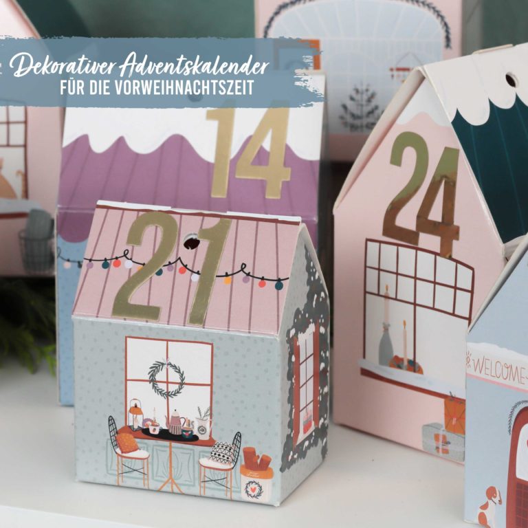 Adventskalender Weihnachtsdorf bunt Papierdrachen